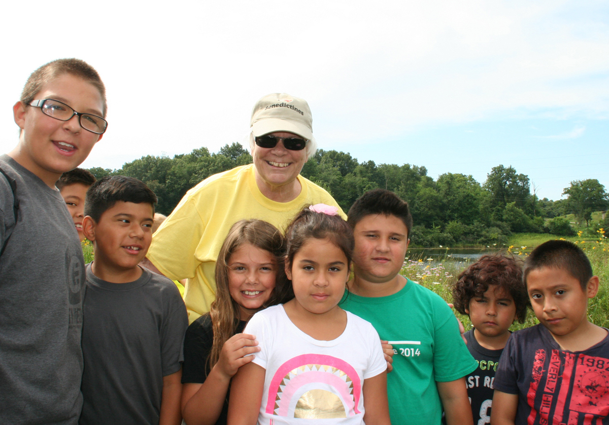 Sister Bobbi Bussan welcomes children to monastery grounds