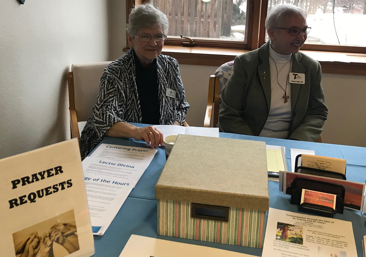 Sister Marlene Miller helps at the Listen UP Open House