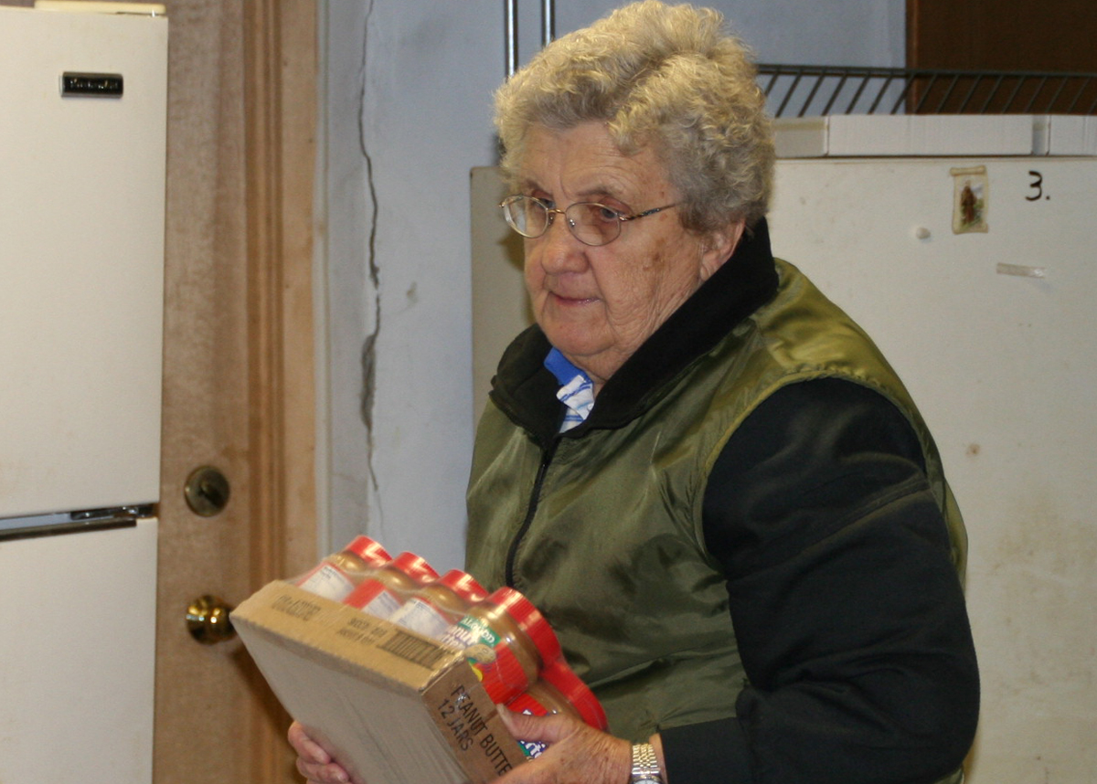 Catholic Benedictine Sister Anne Newcomer at food pantry