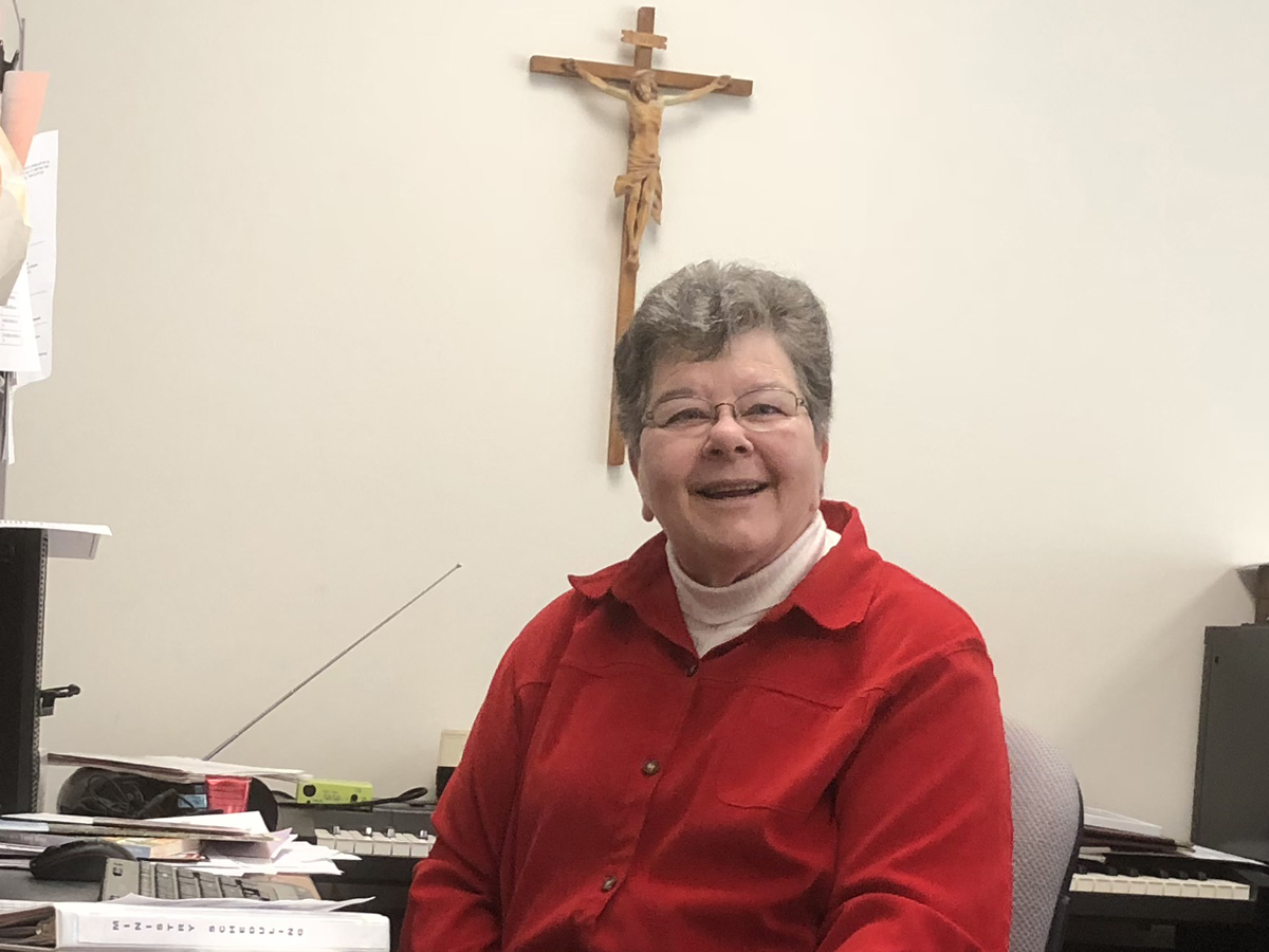 Benedictine Catholic Sister Mary Core sits at her monastery desk.